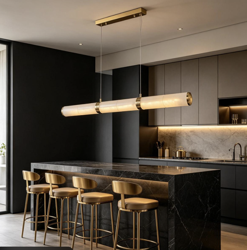 Linear illuminated pendant above a dark marble kitchen island