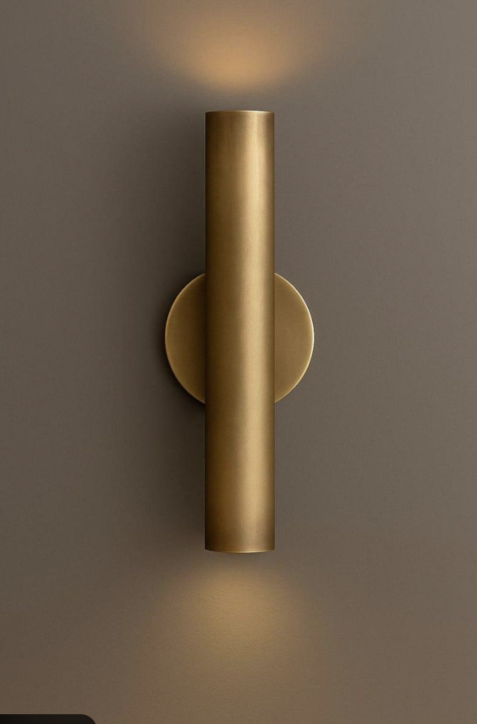 Minimal cylindrical wall light casting light upward and downward
